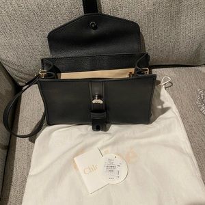 Black Leather Bag with zipper in the middle. Only used 2-3 times.